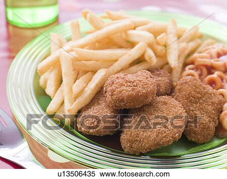 Chicken Nuggets with Spaghetti Hoops and Chips View Large Photo Image Stock Photography - Chicken Nuggets with Spaghetti Hoops and Chips. Fotosearch