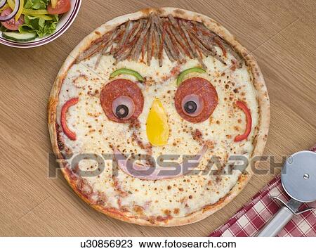 Smiley Faced Pizza with a Side Salad View Large Photo Image Stock Image - Smiley Faced Pizza with a Side Salad. Fotosearch