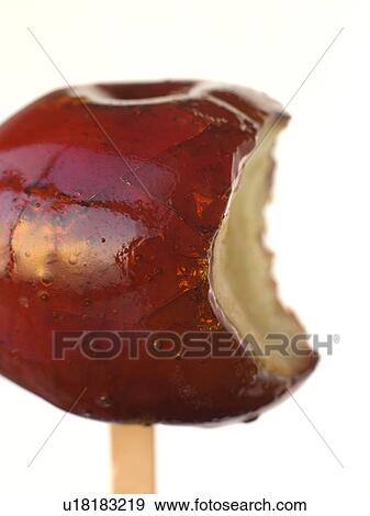 Toffee Apple with a bite taken View Large Photo Image Stock Photo - Toffee Apple with a bite taken. Fotosearch