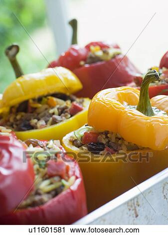 Stock Image - Bell Peppers stuffed with Spiced Rice and Dried Fruits. Fotosearch