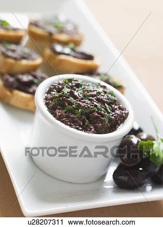 Black Tapenade on Toasts View Large Photo Image Stock Image - Black Tapenade on Toasts. Fotosearch