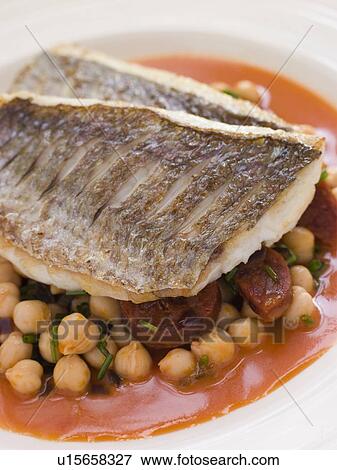 Stock Photo - Fillets of Sea Bream with Chorizo Sausage Chickpeas and Tomato Sauce. Fotosearch
