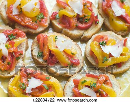 Stock Image - Open Tomato and Roasted Pepper Sandwich with Manchego Cheese. Fotosearch