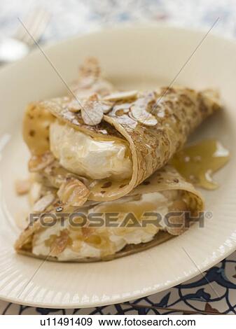 Stock Photo - Pancakes Filled with Almond Cream and Sherry Caramel. Fotosearch