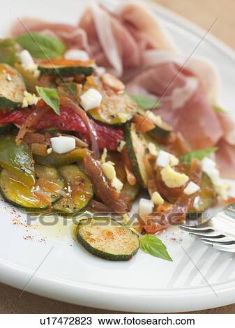 Stock Image - Pisto Manchego and Serano Ham. Fotosearch