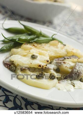 Spanish- Style Potato Gratin with Green Beans View Large Photo Image Picture - Spanish- Style Potato Gratin with Green Beans. Fotosearch