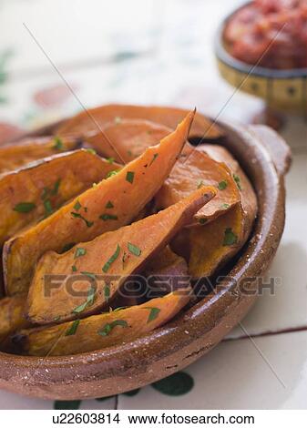 Sweet Potato Wedges with Tomato Salsa View Large Photo Image Picture - Sweet Potato Wedges with Tomato Salsa. Fotosearch