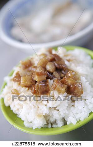 Stock Photo - Close-up of a bowl of braised pork rice. Fotosearch