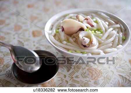 Close-up of a bowl of cuttlefish with rice noodle View Large Photo Image Stock Image - Close-up of a bowl of cuttlefish with rice noodle. Fotosearch