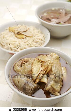 Close-up of a bowl of sesame oil chicken View Large Photo Image Stock Photograph - Close-up of a bowl of sesame oil chicken. Fotosearch