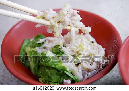 Stock Photograph - Close-up of eel pasta in the bowl. Fotosearch