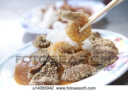 Stock Image - Close-up of fried shrimp and pig's liver. Fotosearch