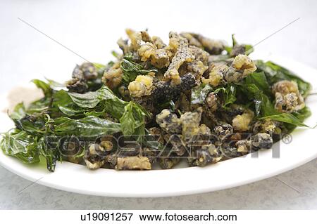 Close-up of fried snake skin on the plate View Large Photo Image Stock Photo - Close-up of fried snake skin on the plate. Fotosearch