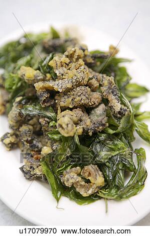 Stock Image - Close-up of fried snake skin. Fotosearch