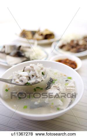 Stock Photo - Close-up of milkfish porridge in the bowl. Fotosearch