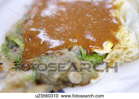 Close-up of oyster omelet View Large Photo Image Stock Image - Close-up of oyster omelet. Fotosearch
