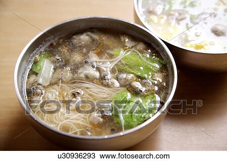 Stock Image - Close-up of oyster thin noodles in a bowl. Fotosearch