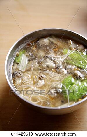 Stock Image - Close-up of oyster thin noodles. Fotosearch