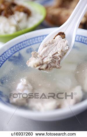 Stock Image - Close-up of pork chop soup. Fotosearch