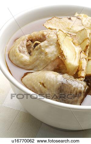 Stock Image - Close-up of sesame oil chicken in the bowl. Fotosearch