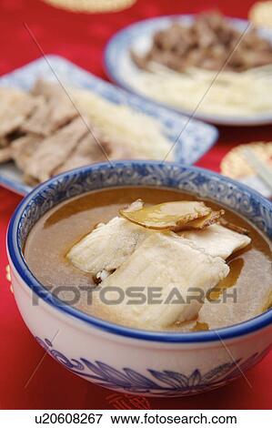 Stock Photo - Close-up of sesame oil fish fillet in the bowl. Fotosearch