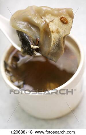 Stock Photo - Close-up of turtle soup in a bowl. Fotosearch