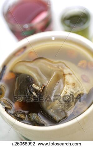 Stock Image - Close-up of turtle soup in the bowl. Fotosearch