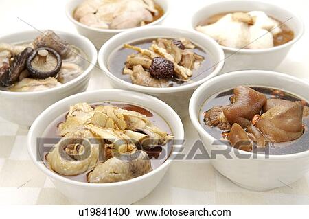 Stock Image - Mushroom Chicken, sesame oil chicken, sesame oil fish fillet and Chinese angelica pig knuckle. Fotosearch