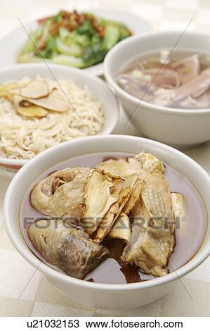 Stock Image - Sesame oil noodles and sesame oil chicken in the bowl. Fotosearch