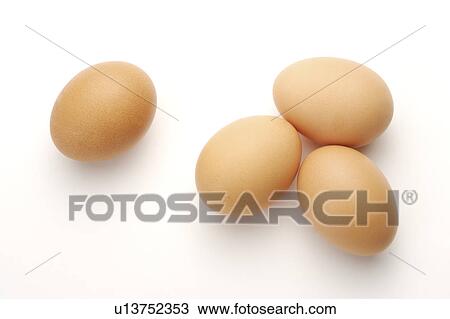 Stock Image - Close-up of four eggs. Fotosearch