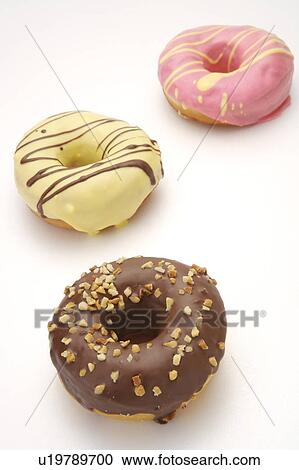 Stock Image - Close-up of three donuts. Fotosearch