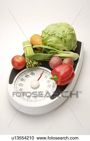 Different kinds of vegetables on the weight scale View Large Photo Image Stock Image - Different kinds of vegetables on the weight scale. Fotosearch