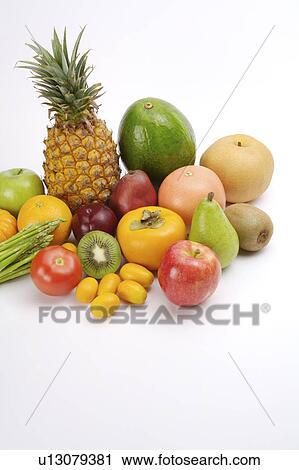 Stock Image - Close-up of a stack of different kinds of fruits and vegetables, close-up. Fotosearch