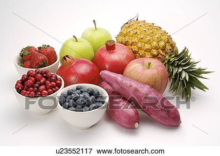 Stock Photo - Close-up of a stack of different kinds of fruits and vegetables. Fotosearch