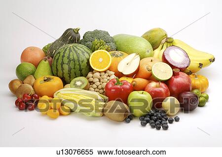 Stock Photography - Close-up of a stack of different kinds of fruits and vegetables. Fotosearch