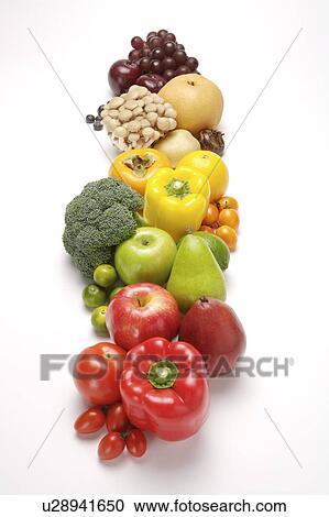 Stock Image - Close-up of a stack of fresh fruits and vegetables in a row. Fotosearch