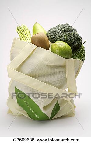 Stock Photo - Close-up of a stack of fruits and vegetables in a bag. Fotosearch