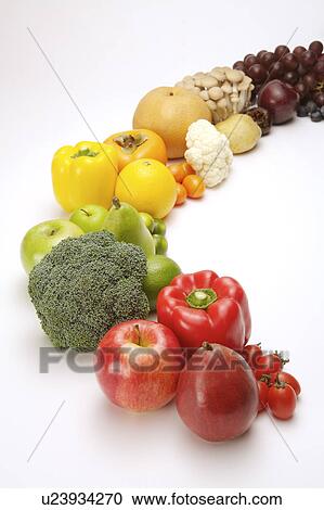 Stock Image - Close-up of different kinds of fruits and vegetables in the crescent shape. Fotosearch