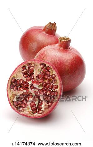 Close-up of two red pomegrants and a half section View Large Photo Image Picture - Close-up of two red pomegrants and a half section. Fotosearch