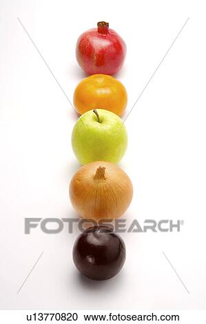 Stock Image - Five fruits and vegetables in a row, close-up. Fotosearch