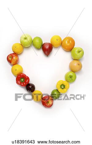 Stock Image - Fruits and vegetables of a heart shape, close-up. Fotosearch