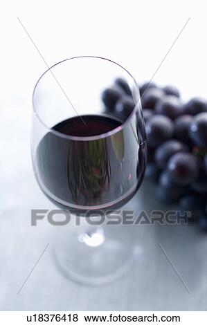 Close-up on glass of red wine View Large Photo Image Stock Photo - Close-up on glass of red wine. Fotosearch