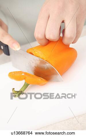 Hand of Japanese woman cutting paprika View Large Photo Image Picture - Hand of Japanese woman cutting paprika. Fotosearch