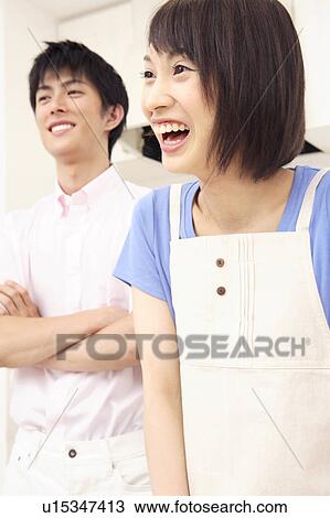 Japanese couple in a kitchen View Large Photo Image Stock Image - Japanese couple in a kitchen. Fotosearch