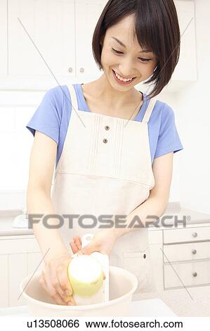 Woman making grated radish View Large Photo Image Stock Photograph - Woman making grated radish. Fotosearch
