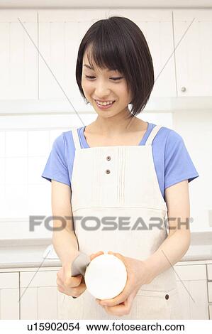 Woman peeling Japanese white radish View Large Photo Image Picture - Woman peeling Japanese white radish. Fotosearch