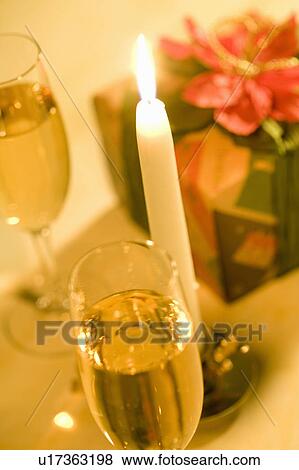Stock Photo - Champagne and Candle. Fotosearch