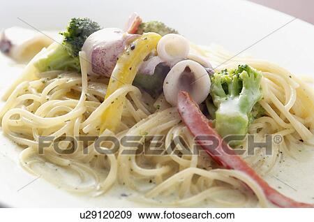 Stock Photo - Pasta with vegetables and sauce. Fotosearch