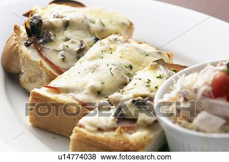 Toast with ham and cheese View Large Photo Image Stock Photo - Toast with ham and cheese. Fotosearch