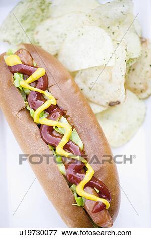 Hotdog with chips View Large Photo Image Stock Photo - Hotdog with chips. Fotosearch